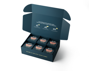 Spirit Origin Coffee six-pack gift box, an authentic Roatán souvenir roasted at origin in Honduras